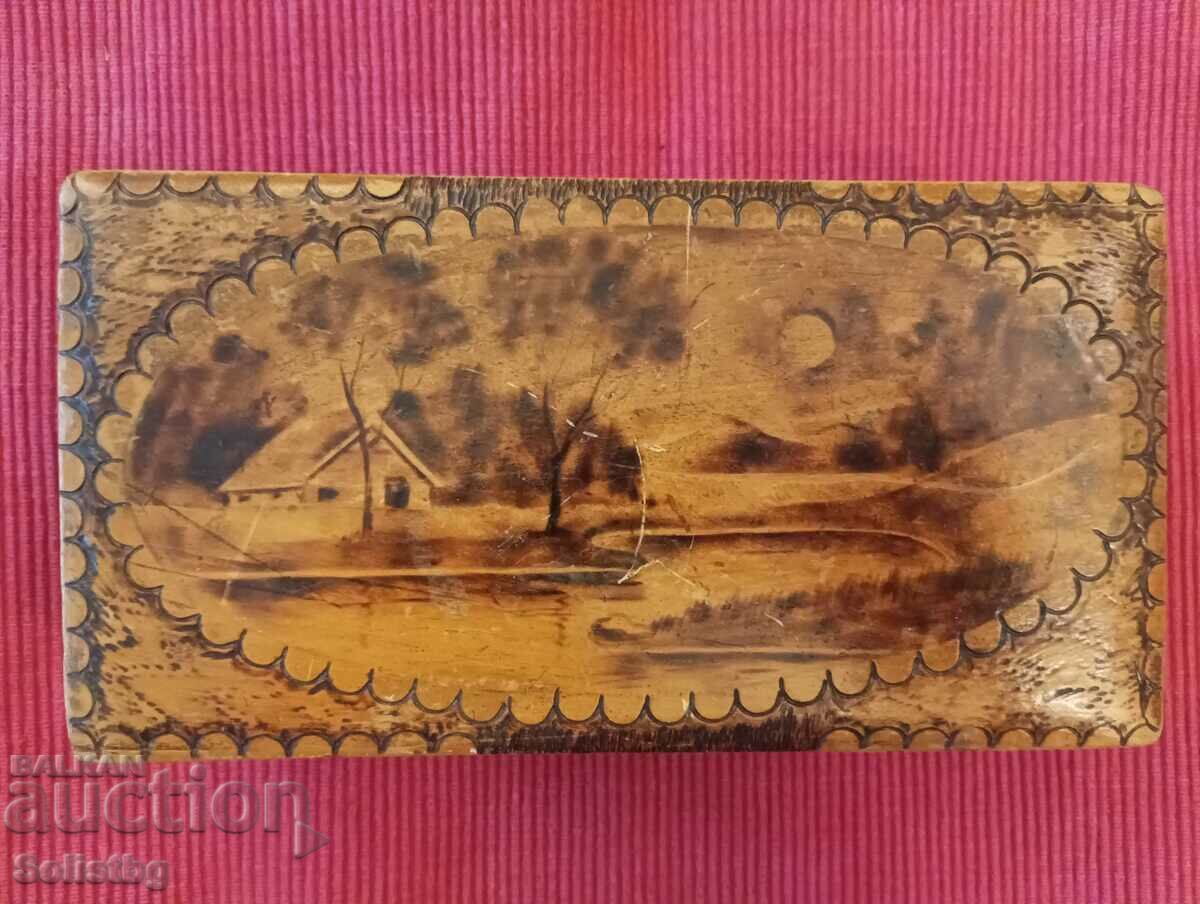 Old pyrographed wooden box.