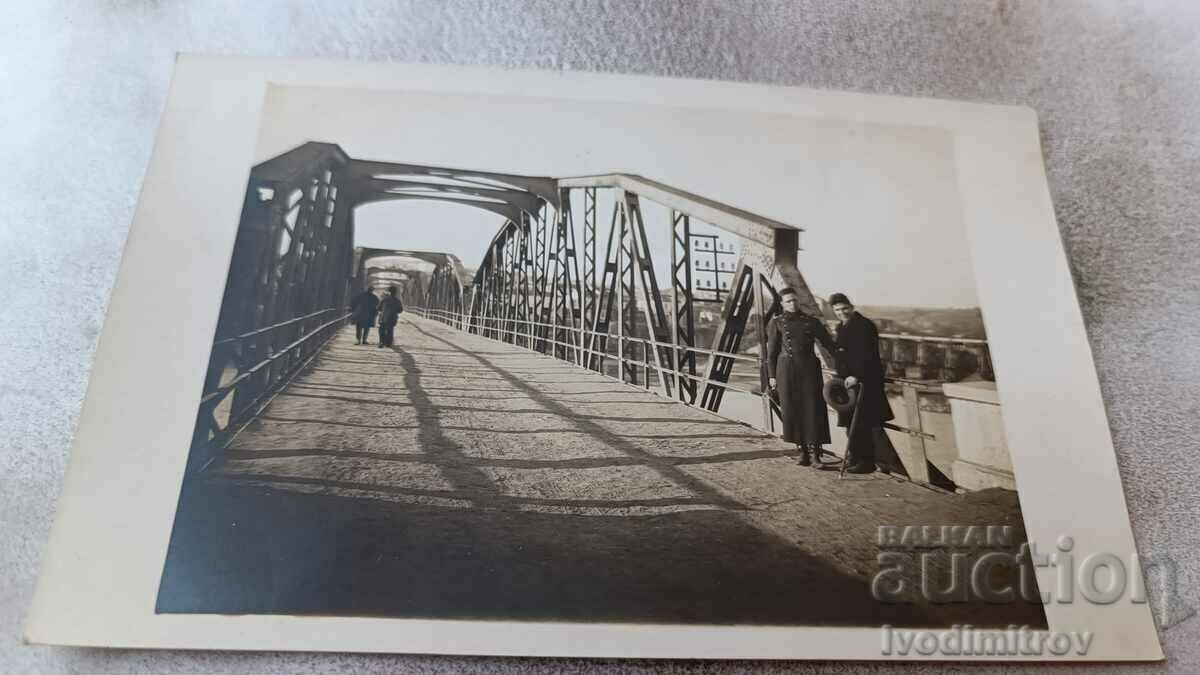 Photo Simeonovgrad An officer and a man on a bridge over the river Maritsa