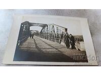 Photo Simeonovgrad An officer and a man on a bridge over the river Maritsa