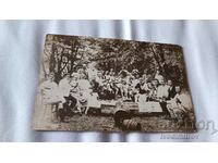 Photo Officers and men having a drink at a picnic