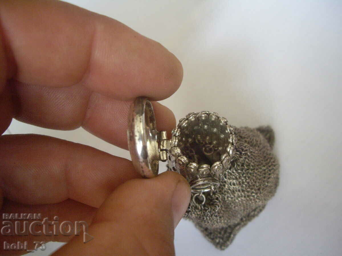Auction  A very interesting old silver purse.