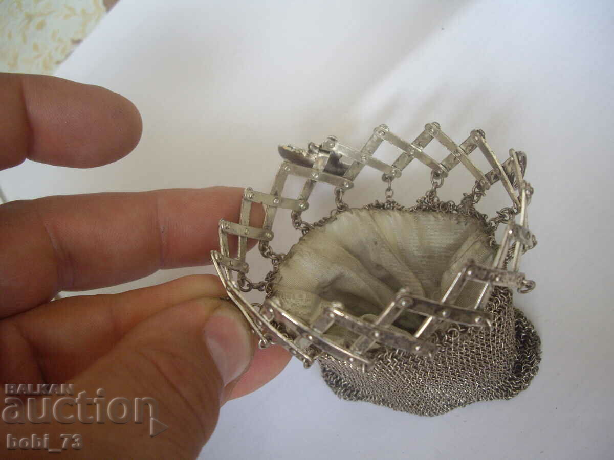 Delivery of A very interesting old silver purse.