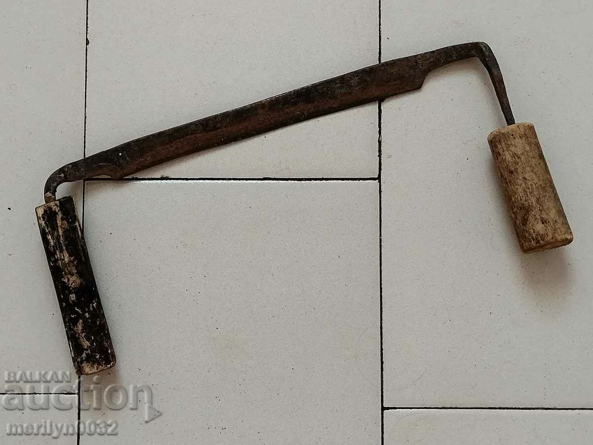 Old hand wrought iron tool