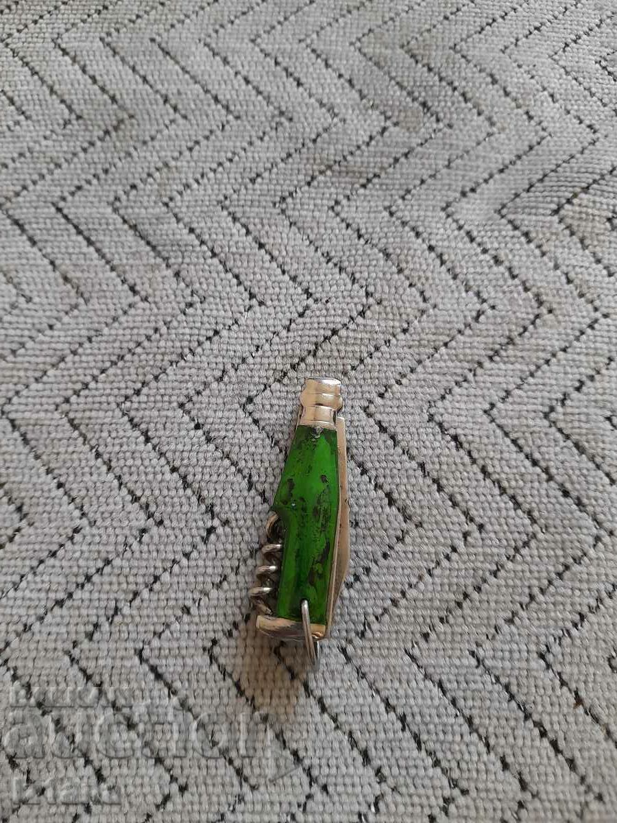 Old key ring, knife, bottle