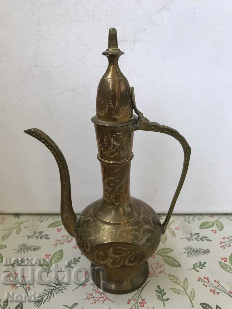 A brass pitcher