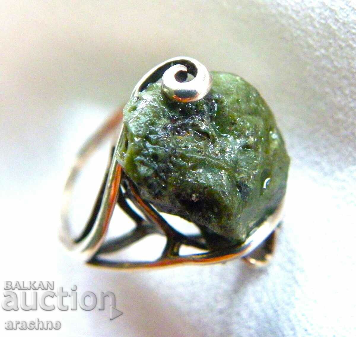 Old silver ring with moldavite