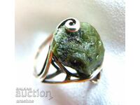 Old silver ring with moldavite