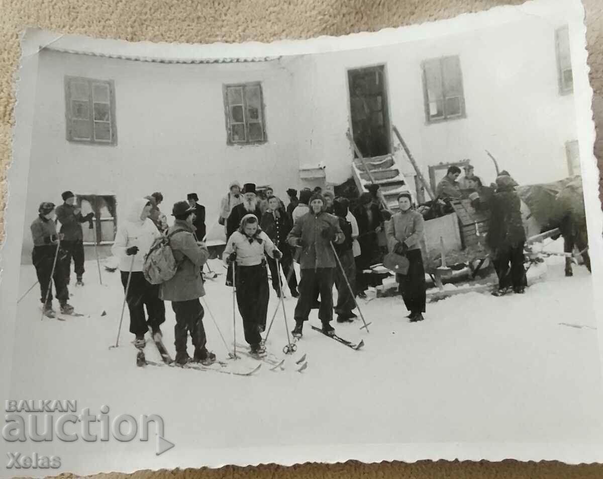 Old photo priest, priest in the mountains on skis