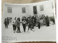 Old photo priest, priest in the mountains on skis