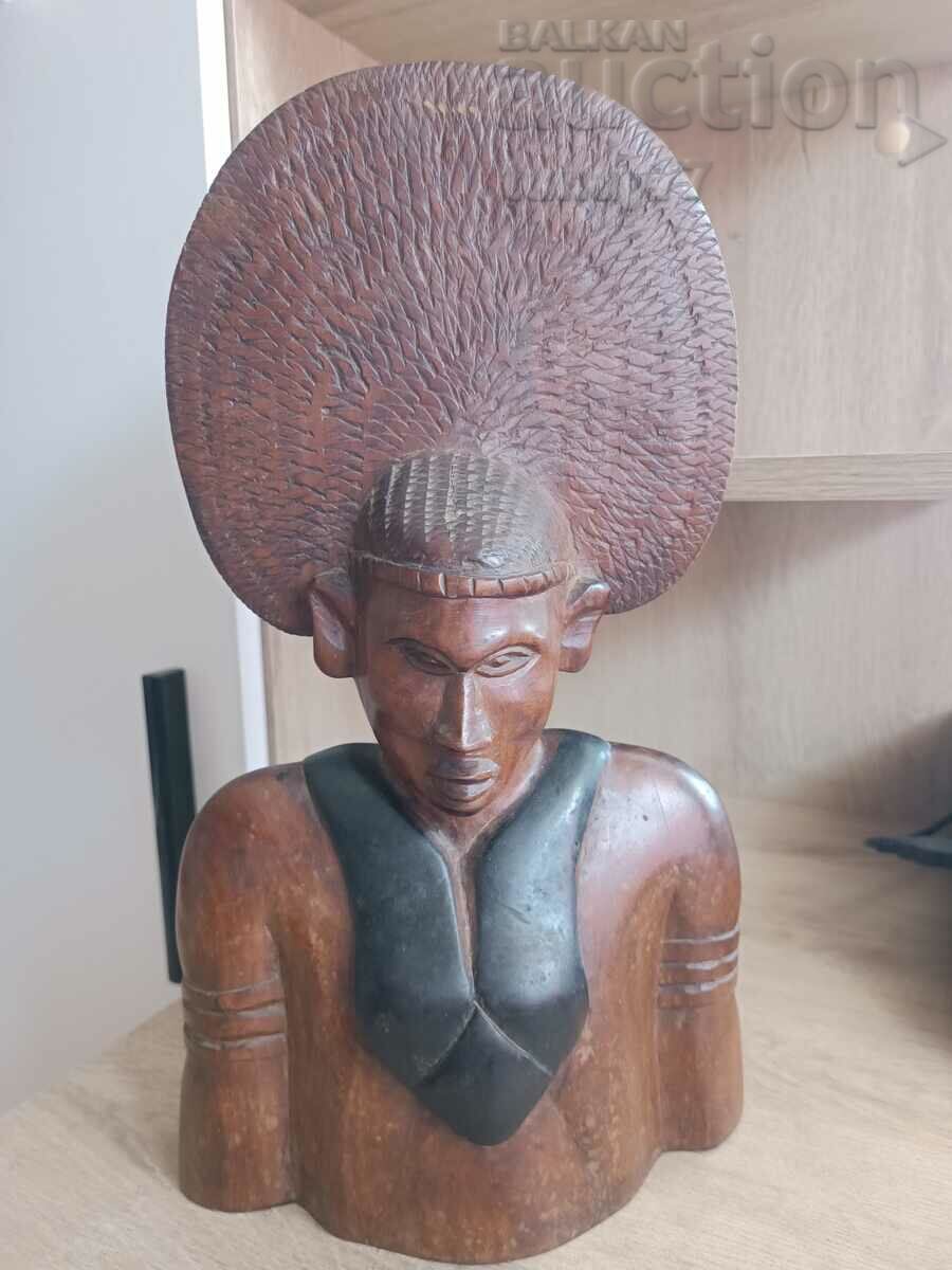 A massive ebony African pharaoh figure weighs quite a bit