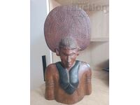 A massive ebony African pharaoh figure weighs quite a bit