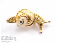 Antique brooch, snail