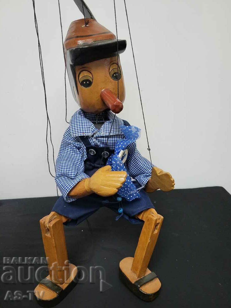 Wooden puppet on threads Pinocchio / Pinocchio