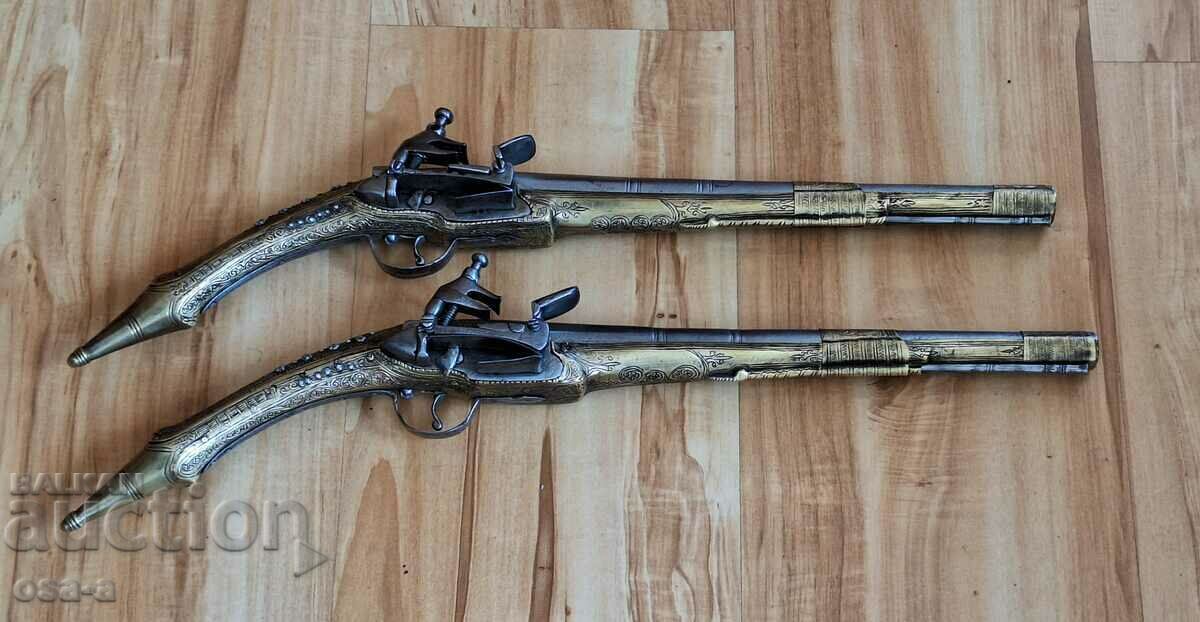 A pair of shotgun revolver pistols