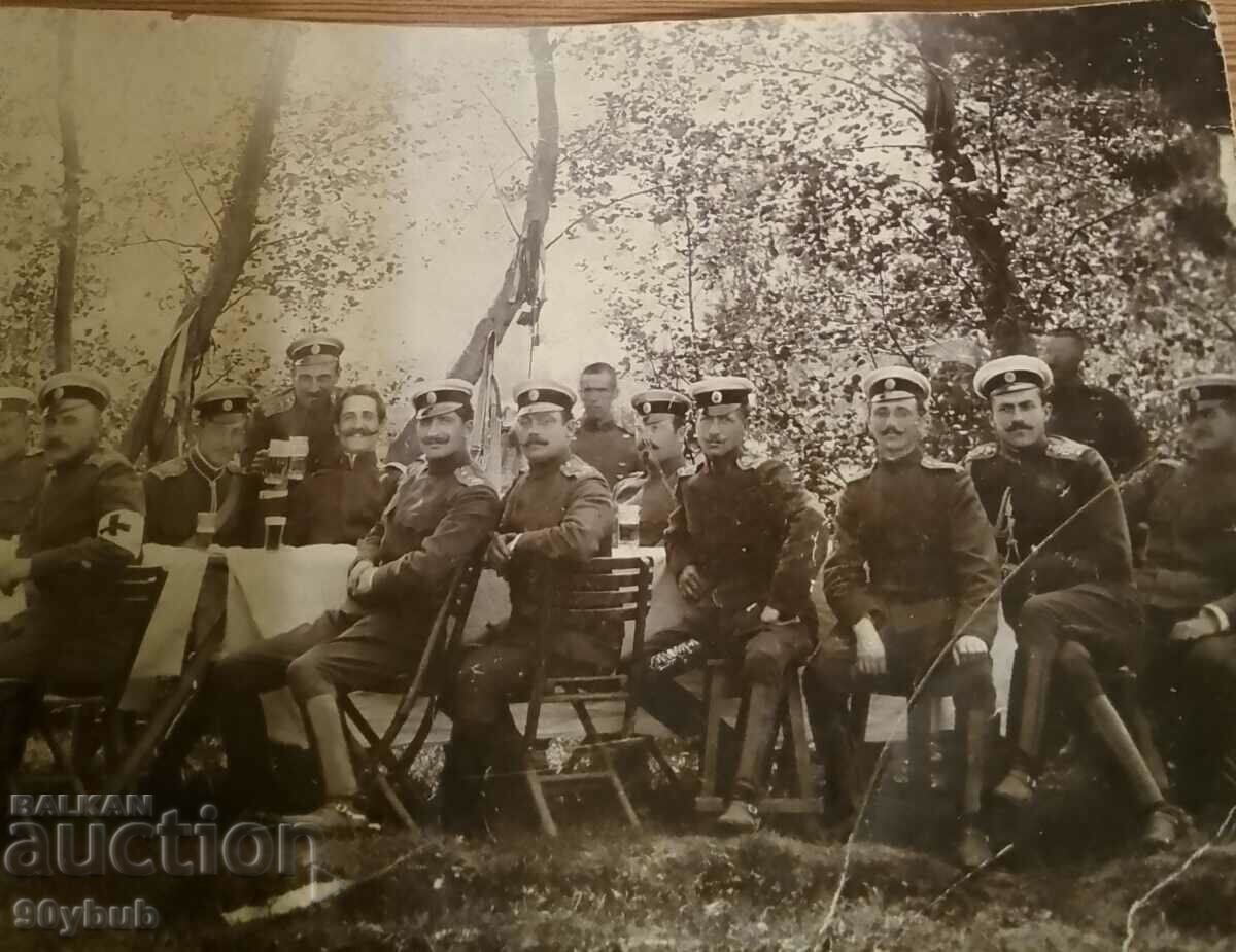 Delivery of Old photo paper thin senior military on table red cross