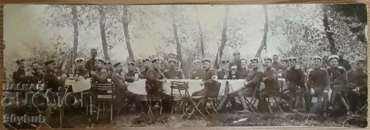 Old photo paper thin senior military on table red cross