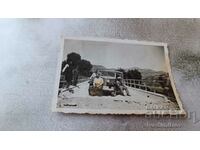 Photo Men on a bridge with a vintage car with registration number Sf 426