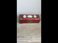 Old cherry jewelry box with brass ornaments