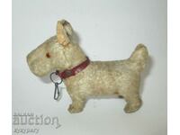 Old small plush toy of a terrier dog