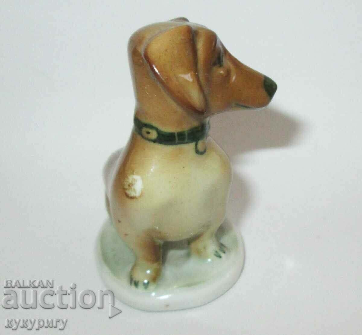 Auction Old small porcelain statuette figure of a Dachshund dog Auction Old small porcelain statuette figure of a Dachshund dog