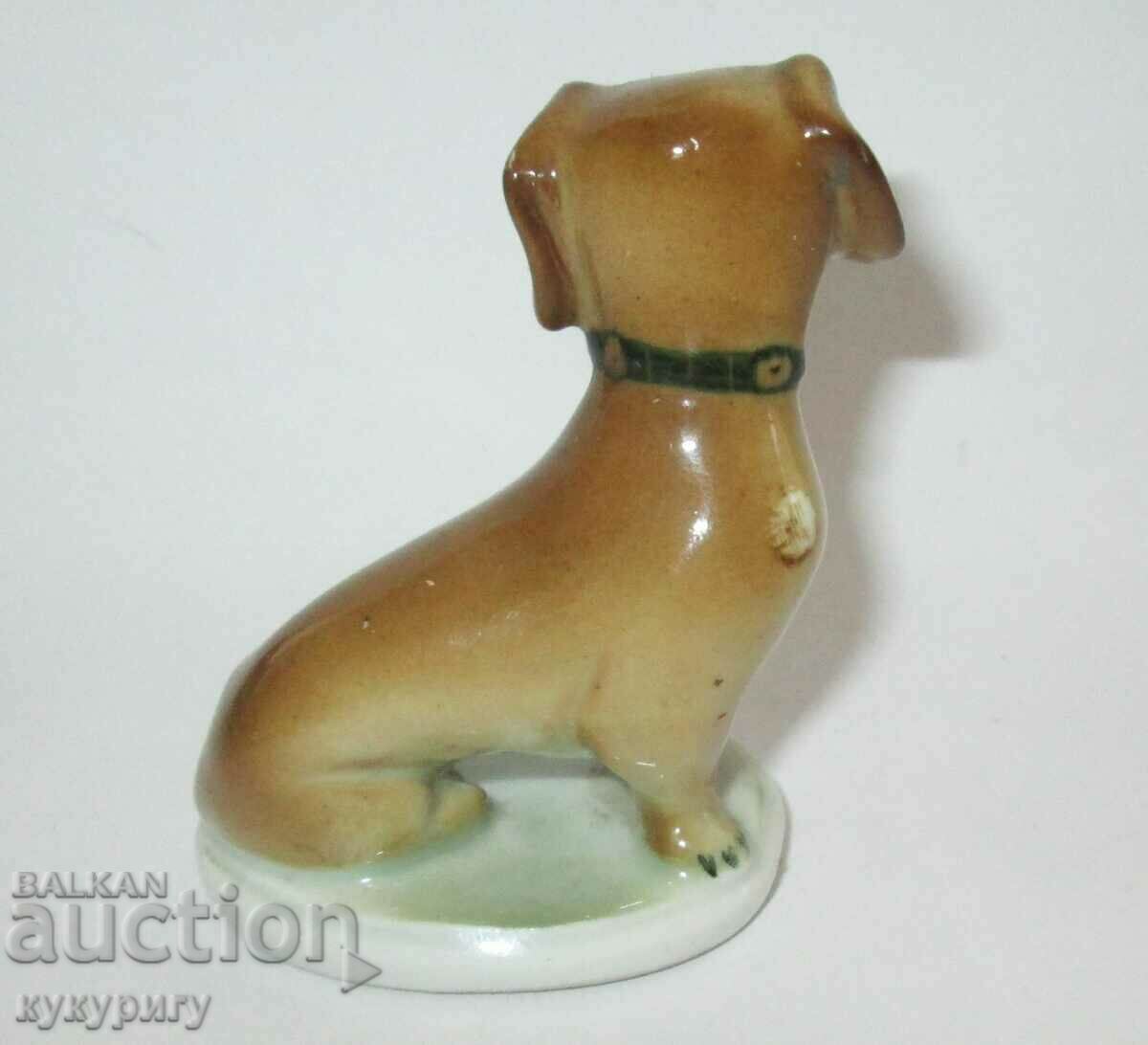 Delivery of Old small porcelain statuette figure of a Dachshund dog Delivery of Old small porcelain statuette figure of a Dachshund dog