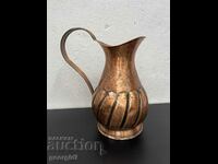 A large hammered copper jug. #5910