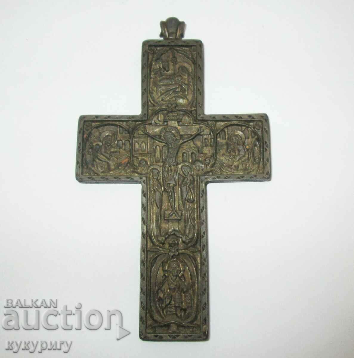 Old cross with religious scenes