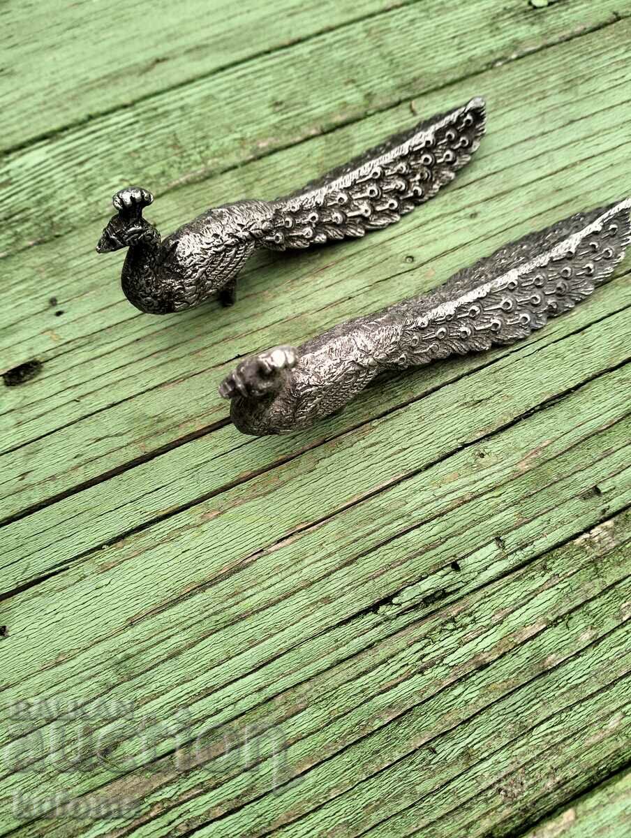 Old metal peacocks