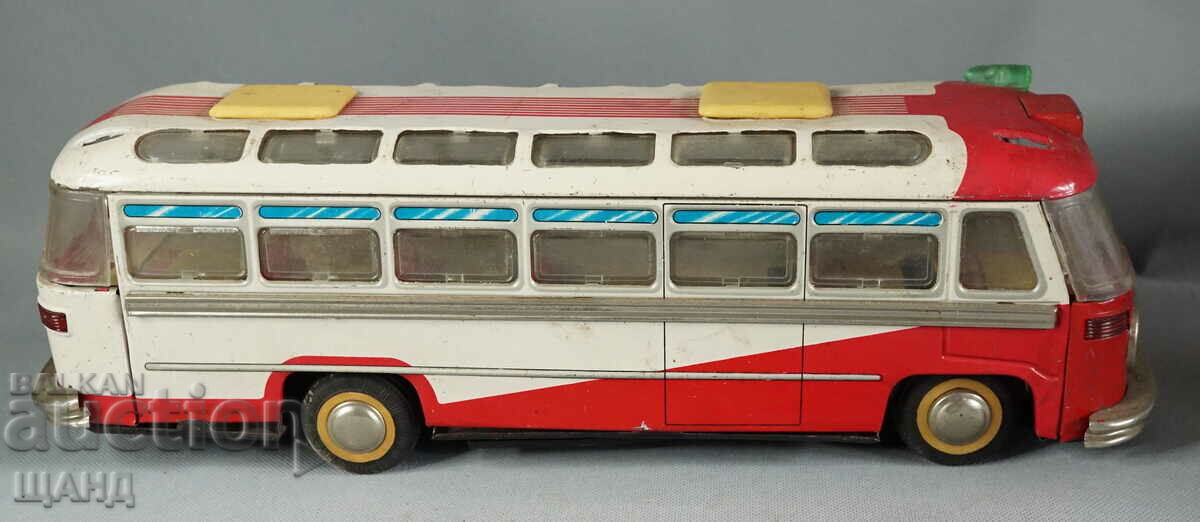 Old metal sheet metal toy model bus battery operated