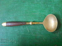 Old bronze serving spoon