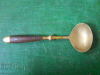 Old bronze serving spoon