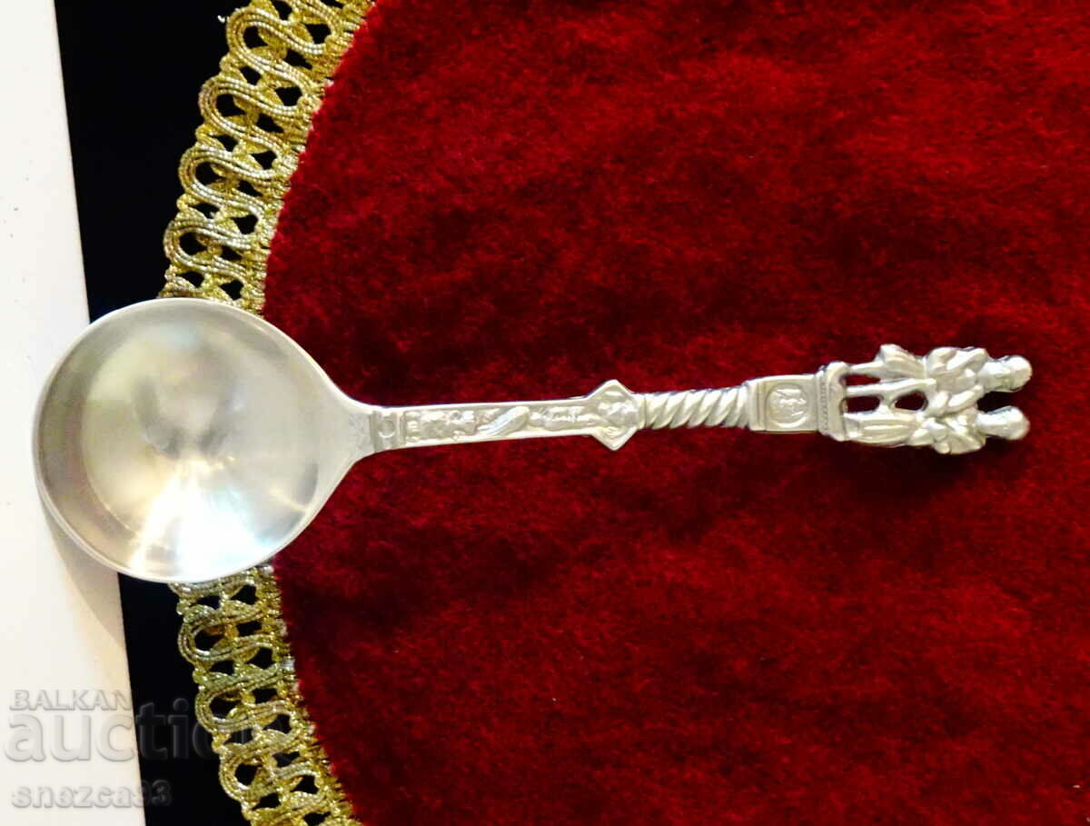 A pewter spoon with figures, for a pewter wedding.