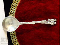 A pewter spoon with figures, for a pewter wedding.