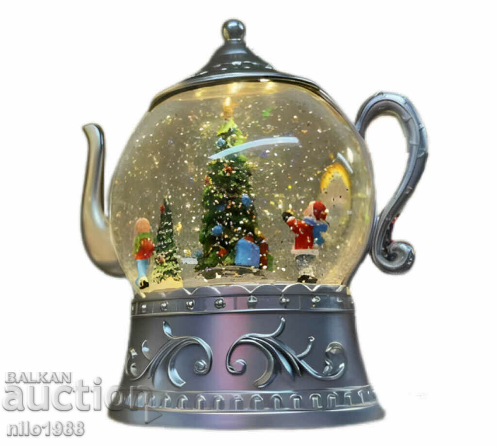 Christmas snow globe in the shape of a teapot