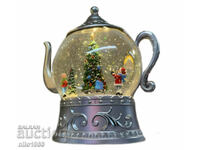 Christmas snow globe in the shape of a teapot