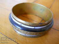 Old bracelet with bone and mother-of-pearl ornaments