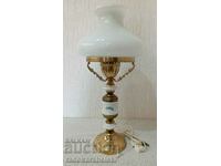 A beautiful vintage lamp with a white glass shade