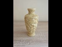 A beautiful alabaster vase with relief figural images!