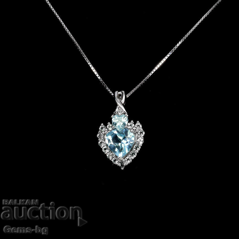 Auction  Silver pendant with natural topaz and zirconium