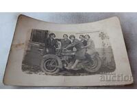 Photo Five girls on a vintage motorcycle