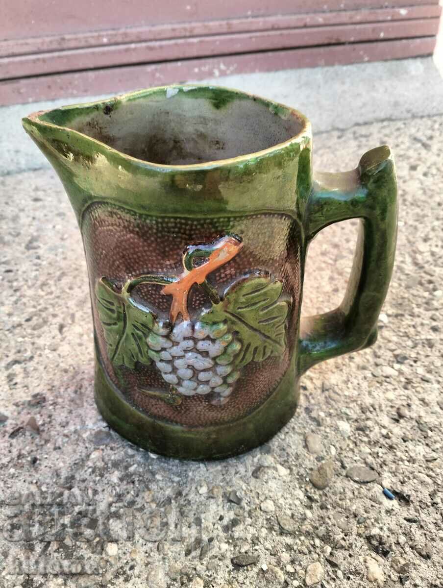 Auction Embossed Trojan ceramic jug Auction Embossed Trojan ceramic jug