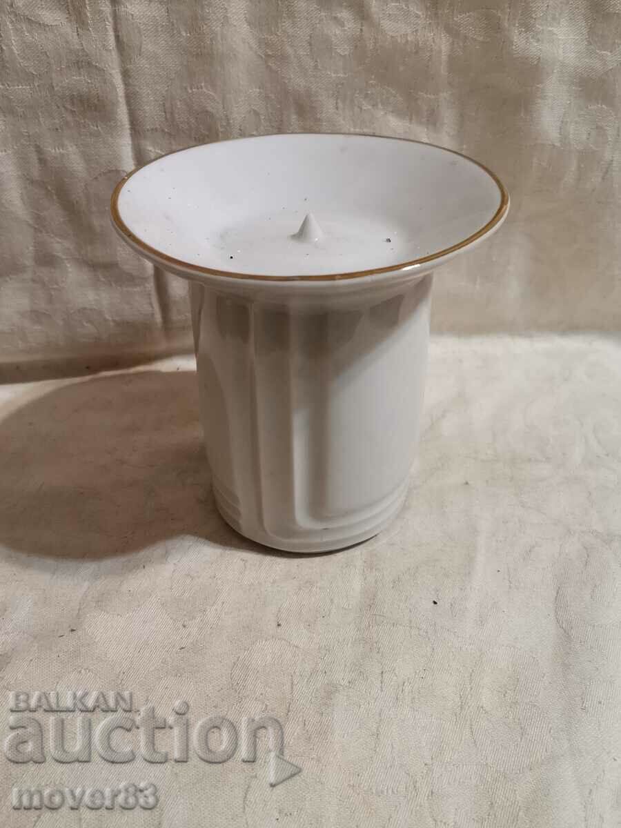 Porcelain candle holder.