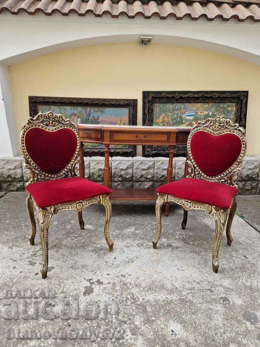 Auction  A pair of superb antique metal chairs