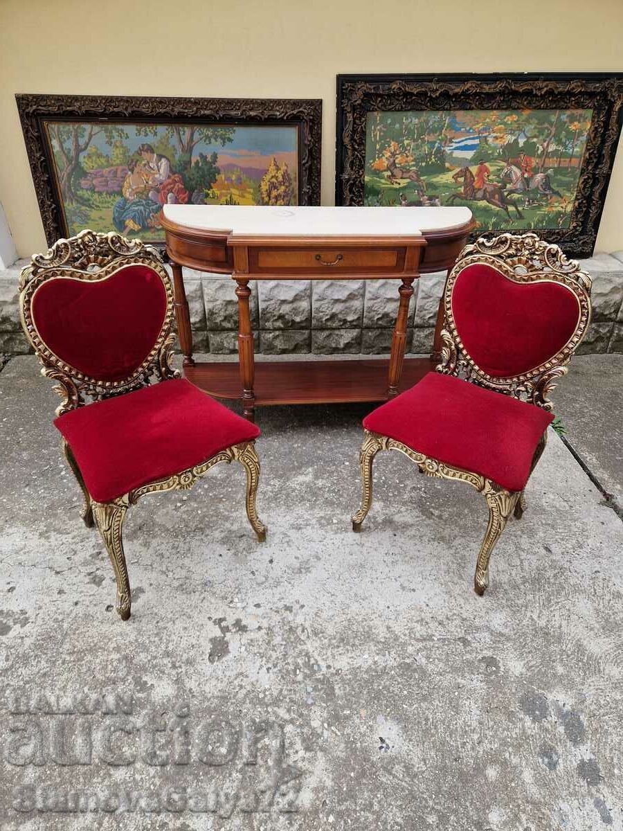 A pair of superb antique metal chairs