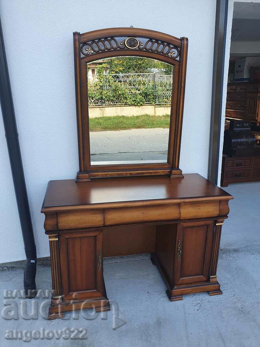 A beautiful wooden chest of drawers with a mirror!