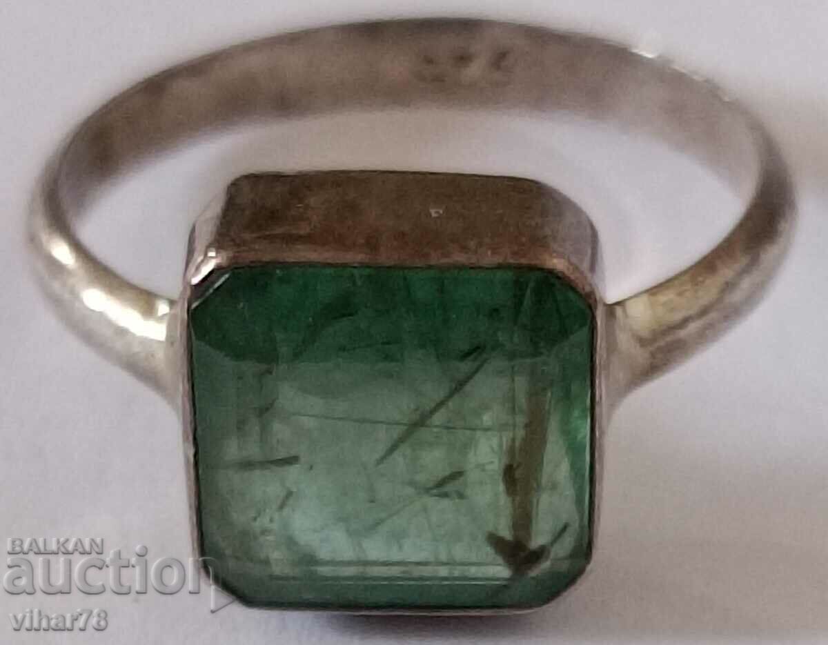 Silver ring with an emerald