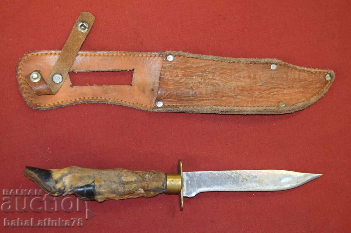 Old steel hunting knife with foot handle