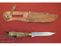 Old steel hunting knife with foot handle