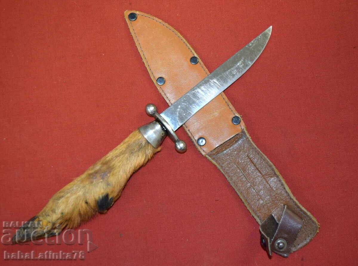 An interesting steel hunting knife with a leg handle