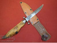 An interesting steel hunting knife with a leg handle